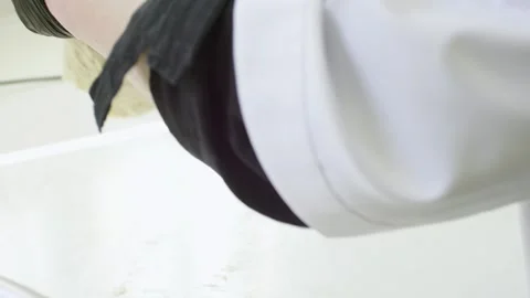 Baker working with dough to prepare buns and bread Stock Footage 280584201