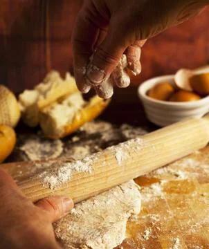 Baker working fresh bread dough Stock Photos