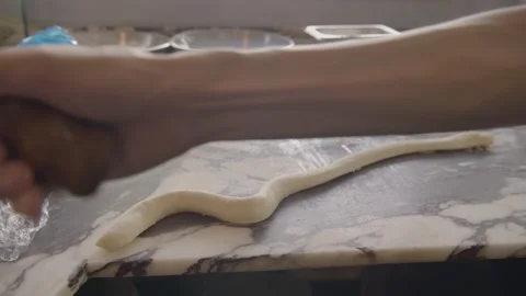 Baker Wrapping Dough Around Spit in Commercial Kitchen, Sydney, Australia Stock Footage 345658225