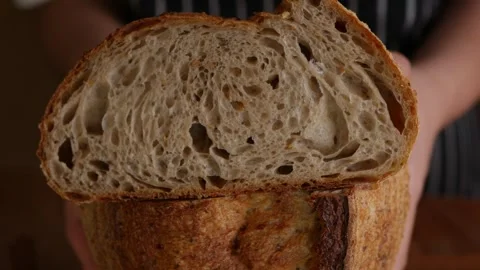 Baker’s Hand Presenting Sourdough. Stock Footage 308233309