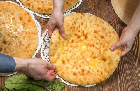 Baker's hands folded pie Stock Photos
