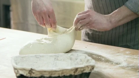 The Baker's hands. Process the dough for wheat bread. Rustic style Stock-Footage 71692564
