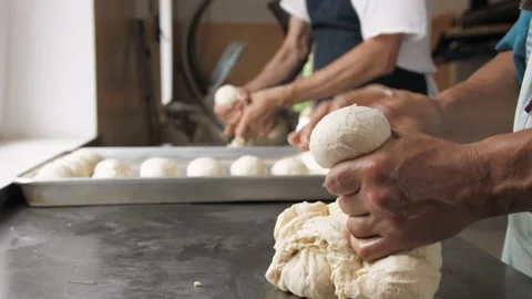 Bakers make rolls from dough Stock Footage 133090637