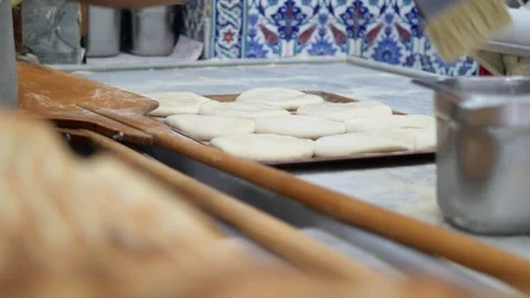Bakers prepare fresh bread in traditional bakery setting Video stock 318382395