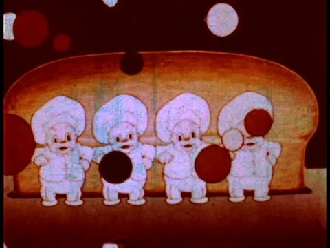 Bakers sing on a stage with a loaf of bread that gets wrapped, in a cartoon, in Stock Footage 75071738