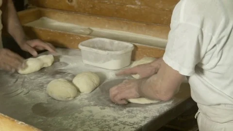 Bakers at work while preparing bread Stock Footage 75868856