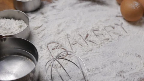 Bakery Accessories Background with bakery text writing on flour. Stock Footage 96164298
