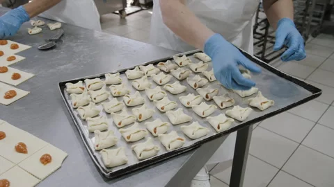 Bakery Assembly: Apricot Jam Puff Pastries on Tray Stock-Footage 321132659