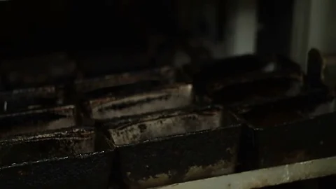 Bakery. Baker lays dough in baking molds Video stock 74394238