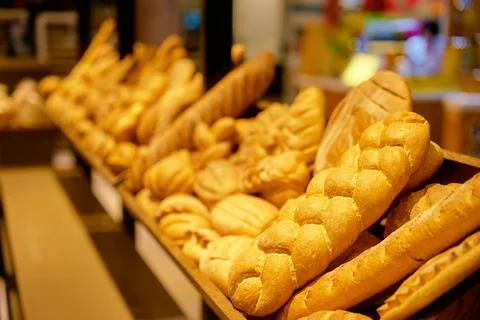 Bakery. Batch of fresh textured buns. Stock Photos