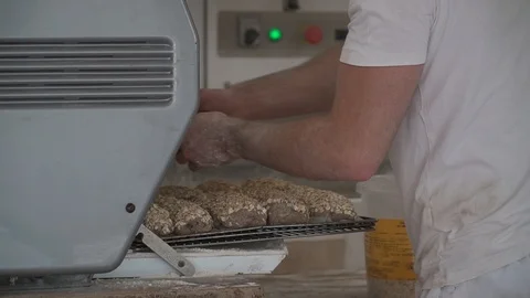 In the bakery the buns are placed on the grill in the oven close-up Stock Footage 113226256