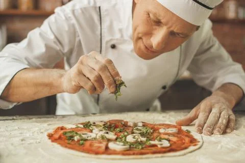 Bakery chef cooking bake in the kitchen professional Stock Photos