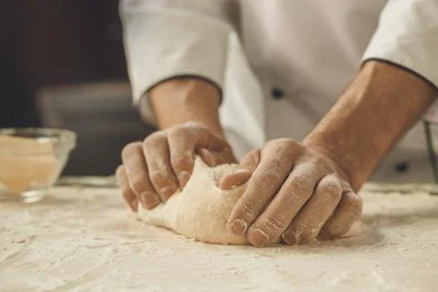 Bakery chef cooking bake in the kitchen professional Stock Photos