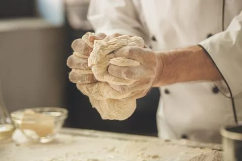 Bakery chef cooking bake in the kitchen professional Stock Photos