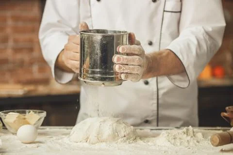 Bakery chef cooking bake in the kitchen professional Stock Photos