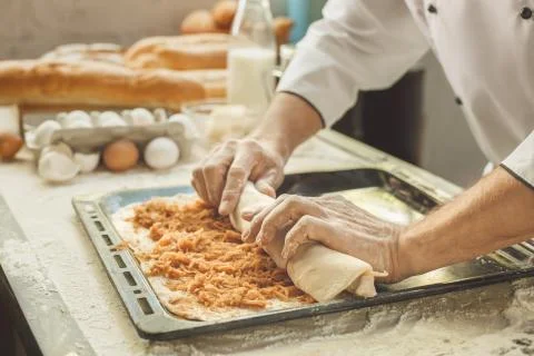 Bakery chef cooking bake in the kitchen professional Stock Photos
