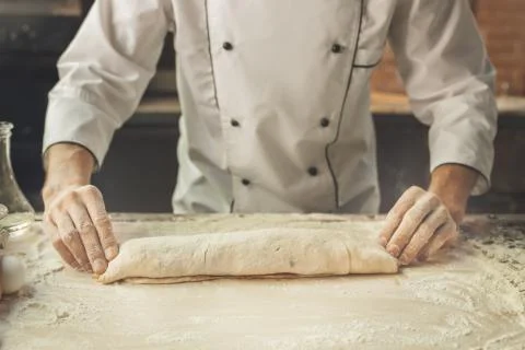 Bakery chef cooking bake in the kitchen professional Stock Photos