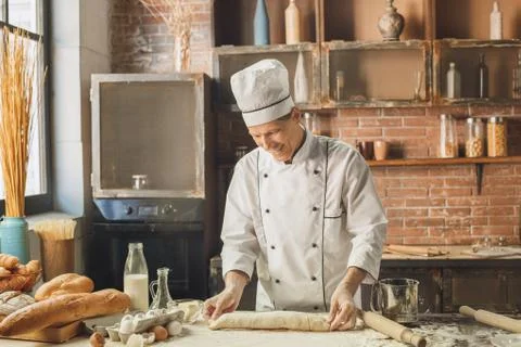 Bakery chef cooking bake in the kitchen professional Stock Photos