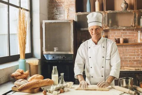 Bakery chef cooking bake in the kitchen professional Stock Photos