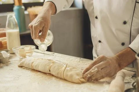 Bakery chef cooking bake in the kitchen professional Stock Photos
