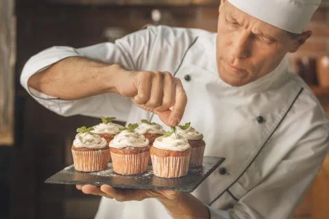 Bakery chef cooking bake in the kitchen professional Stock Photos
