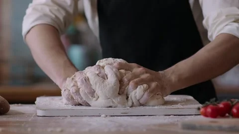 Bakery chef Kneading the dough for making homemade bread, pizza, pie, pastries Stock Footage 261654899