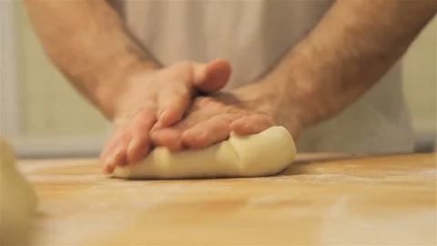Bakery chef kneading raw dough. Stock Footage 123396053