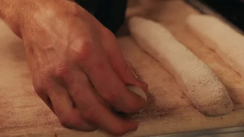 Bakery chef making fresh Artesian buns and baguettes using traditional recipe Stock Footage 275096546