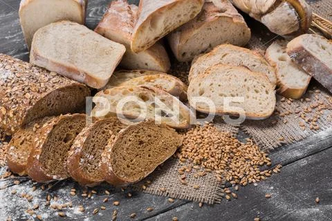 Bakery concept. Plenty of sliced bread background Stock Photos