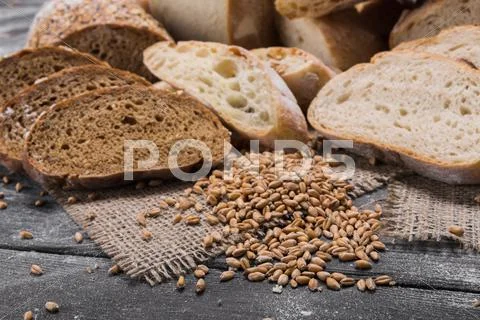 Bakery concept. Plenty of sliced bread background Stock Photos