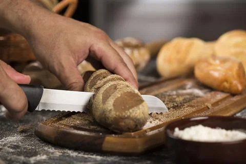 The bakery. Different types of fresh breads on the table. Stock Photos