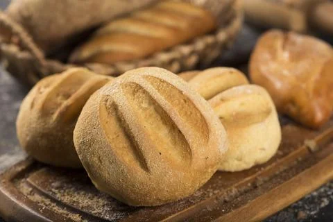 The bakery. Different types of fresh breads on the table. Stock Photos
