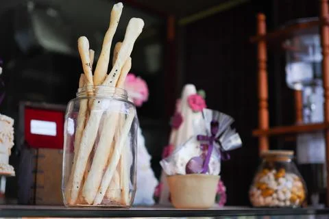 Bakery display with breadsticks in a clear jar Stock Photos