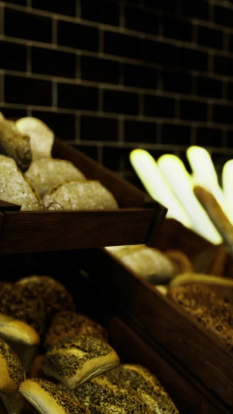 Bakery display of different types of bread and rolls at local shop 動画素材 331669053