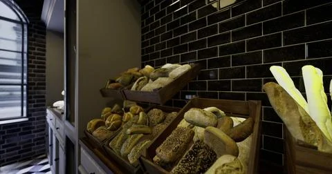 Bakery display featuring a variety of fresh breads in a modern setting Stock Illustration