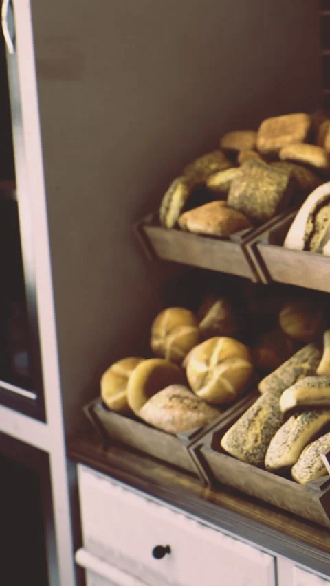 Bakery display with fresh bread and rolls during daytime hours Stock Footage 334247880