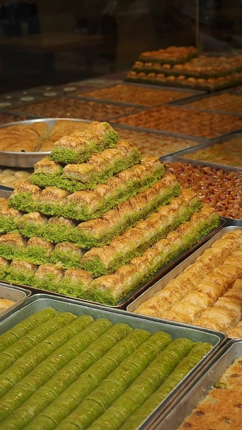 Bakery display full of sweets and pastries in a shop Stock Footage 339827856
