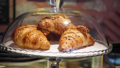 Bakery display shows fresh pastries in a glass case at a cafe Stock Footage 345473202