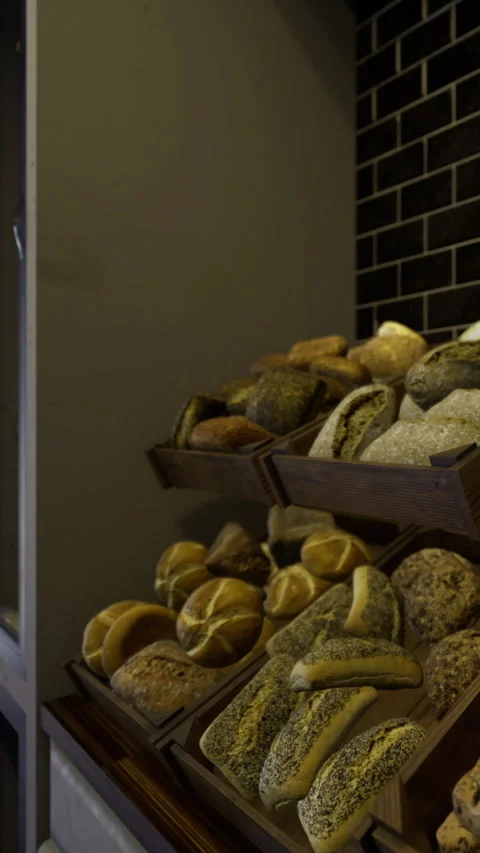 Bakery display with various types of bread at a local store in the afternoon Stock Footage 342440767