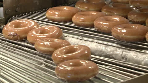 BAKERY DONUTS ON CONVEYOR MACHINE WITH GLAZE SUGAR HD 1080 Video stock 25682835