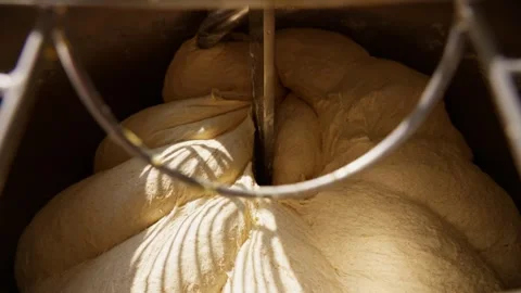 Bakery dough mixing close-up of the kneading process in an industrial mixer Video stock 313532815