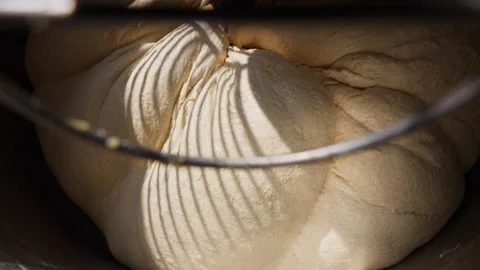 Bakery dough preparation close-up powerful mixer kneading fresh dough for bread Stock Footage 313533161