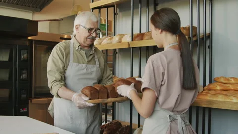 Bakery Employees Putting Fresh Bread on Shelf Stock Footage 156533206