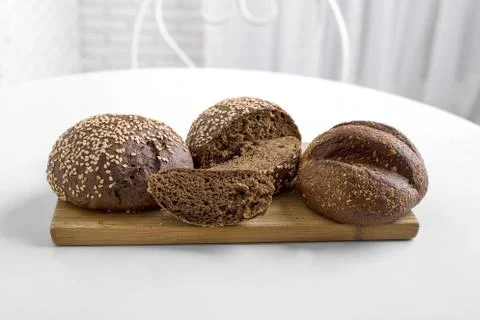 Bakery flour dough black bread with sesame Stock Photos