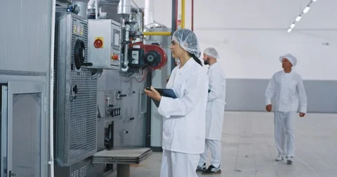 Bakery industry two young engineers with electronic tablet checking the modern Video stock 123059827