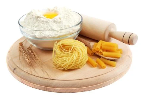 Bakery ingredient. flour with raw eggs for making dough on the wooden board. Stock Photos