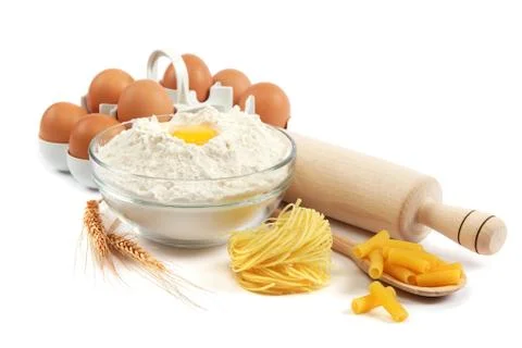 Bakery ingredient. flour with raw eggs for making dough isolated on a white b Stock Photos