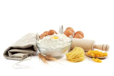 Bakery ingredient. flour with raw eggs for making dough isolated on a white b Stock Photos