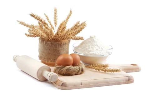 Bakery ingredient. flour with raw eggs for making dough isolated on a white b Stock Photos