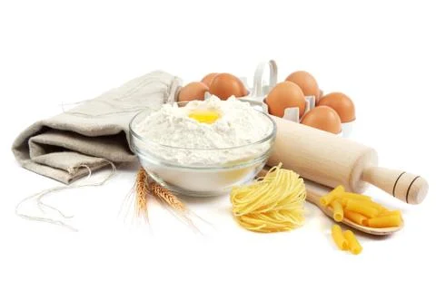 Bakery ingredient. flour with raw eggs for making dough isolated on a white b Stock Photos